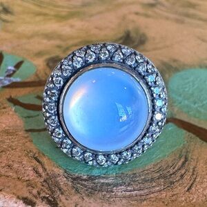 David Yurman ring with center white stone and diamonds